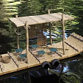 Traditional Wooden Boat Floating on Calm Water With Bamboo Frame Seats and Baskets