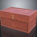 Brown Wooden Box With Intricate Carved Patterns And Decorative Metal Lock