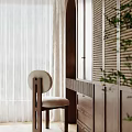 Modern Walk-in Closet With Dark Wooden Cabinets Round Backrest Chair White Curtains And Green Plants