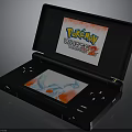 Black Handheld Game Console With Dual Screens Showing Pokémon White 2