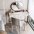 Elegant White Dressing Table With Round Mirror Gold Legs And Skincare Products With White Chair