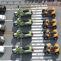 Aerial View of Intersection with Green Orange Scooters and Black White Cars Parked in Lanes