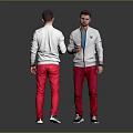 Two Men in White Jackets Red Pants One Holding Cup Against Gray Background
