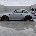 Light Blue Sports Car With Rear Spoiler And Golden Wheels In Empty Indoor Space