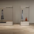 Modern Clothing Boutique Display With Hanging Dresses Racks And Brown Handbag