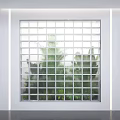 Plant Combination Behind Frosted Glass Block Wall With Layered Green Plants Creating Natural Scenery