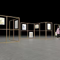 Art Exhibition Space With Golden Frame Panels Displaying Paintings And Person Walking