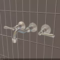 Golden Faucet Mounted On Grey Tile Wall With Two Handles