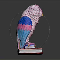 Decorative Owl Figurine With Pink Blue Woven Body Standing On A Red Hardcover Book