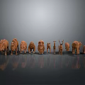 Collection of Animal Wood Carvings Arranged on Gray Background with Reflections