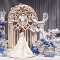 Bride In White Wedding Dress By Ornate Arch With Blue White Flowers And Carved Columns
