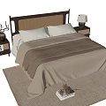 Double bed with wicker headboard neutral bedding on area rug nightstands and table lamp