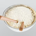 White Bowl Filled With Cooked Rice And Wooden Chopsticks Inside