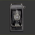 Vintage Folding Camera With Leather Cover Metal Body And Retro Design