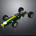 Green and yellow race car model with four wheels white dot and reflective gray background