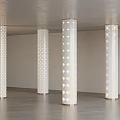 Modern White Columns with Perforated Patterns and Illuminated Effects in Interior Space