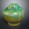 Handcrafted Green Ceramic Jar With Glazed Surface And Traditional Design