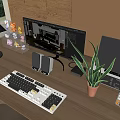 Modern Computer Workspace Setup Featuring Monitor Keyboard Speakers and Potted Plant