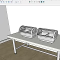 Restaurant Buffet Setup With Two Stainless Steel Food Warmers On White Table