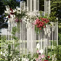 Outdoor Decorative Structure With White Columns And Colorful Flowers On Green Grass