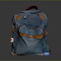 Blue Canvas Backpack With Brown Leather Trim Front Pocket And Decorative Tag 3d model