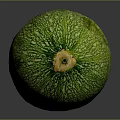 Fresh Green Zucchini Vegetable With Striped Skin On Dark Reflective Surface