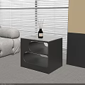 Black Side Table With Curved Design In Living Room Next To Sofa And Blinds