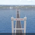 Humen Suspension Bridge With Tall Towers Over Blue Water And Moving Vehicles With Distant Landscape