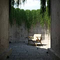 Hanging Green Plants on Concrete Walls Garden Nook with Chair and Table
