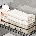 Black Metal Bathroom Shelf With Tissue Packs And Folded Towels Over White Toilet