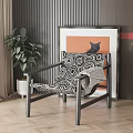 Single Sofa With Black And White Patterned Cushion Green Plant And Orange Background Wall Art