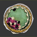 Green Frosted Cake Featuring Pink Decorations Black Berries White Piped Edges and Yellow Bottom Trim