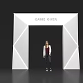 Modern Illuminated Archway Featuring GAME OVER Text And Person Standing Underneath Design
