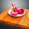 Delicious Cupcakes With Chocolate Decorations Pink Liners On White Plate And Wooden Cutting Board