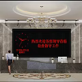 Elegant Front Desk Reception Area With Large Digital Screen Welcome Message Chandelier And Potted Plant