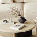 Modern Round Coffee Table With Marble Top Wooden Frame And Decorative Items By Beige Sofa
