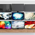 Multiple Flat Screen TVs Display Diverse Scenes On Wooden Shelf With Vibrant Screens