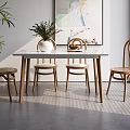 Dining Table Set With White Tabletop And Rattan Wooden Chairs Green Plant And Wall Art