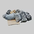 Pile of Gray Garbage Bags and Cardboard Box for Waste Disposal