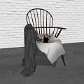 Wooden Armchair With Knitted Blanket Tray And Mug Against White Brick Wall