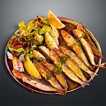 Grilled Small Fish Dish With Lemon Slices Fresh Lettuce And Herbs On Metal Plate
