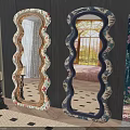 Two Decorative Mirrors With Wavy Frames And Floral Art On Dark Walls