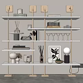 Modern White Shelving Unit with Gold Metal Frame Displaying Decorative Items Books Plants and Glassware