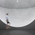 Giant Silver Sphere Commercial Equipment With Intricate Map Carving In Modern Exhibition Hall