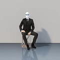 Stylish Mannequin In Black Suit Sitting Near Modern Swing Door
