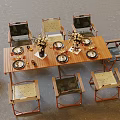 Outdoor Wooden Table With Matching Chairs Dinnerware And Decorative Flower Arrangements