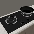 Black Gas Stove Top With Silver Frying Pan And Wooden Cabinets Against Light Colored Wall