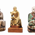 Traditional Buddhist Monk Sculpture Carvings With Sitting Postures And Colorful Details