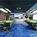 Indoor Sports Fitness Room With Blue Carpet Wooden Wall Blue Chairs And Green Billiard Table
