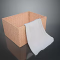 Woven Storage Basket With Soft Light Colored Towel For Home Organization And Daily Use